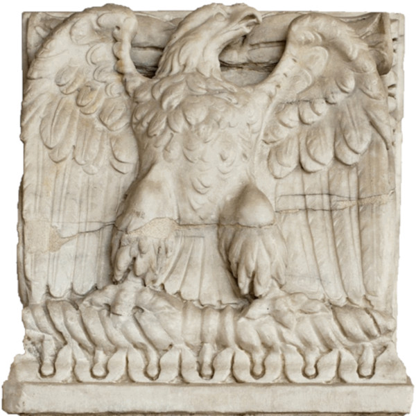 A close-up photograph of a stark, weathered Roman imperial eagle sculpture. The eagle is depicted with its wings spread wide, its feathers carved with sharp, geometric precision, and its talons clutching a bundle of stylized lightning bolts. The background is a flat, neutral gray stone surface, emphasizing the rigid, cold architecture of the piece.