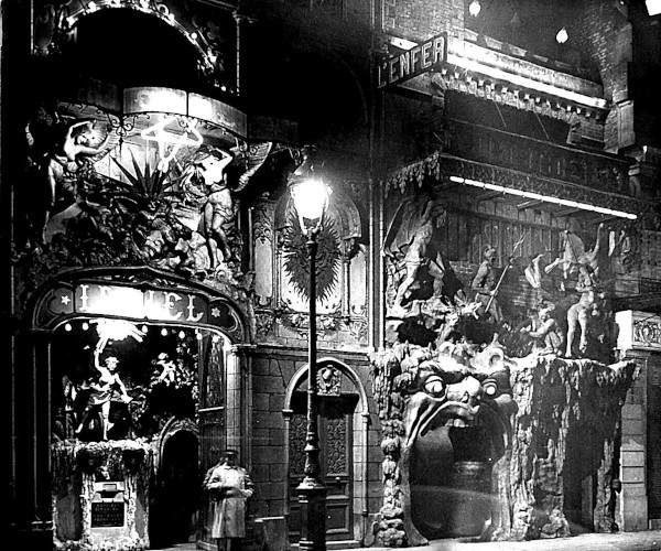 Black and white photograph of the themed facades of Cabaret du Ciel (Heaven) and Cabaret de l'Enfer (Hell) on Boulevard de Clichy in Montmartre, Paris.
