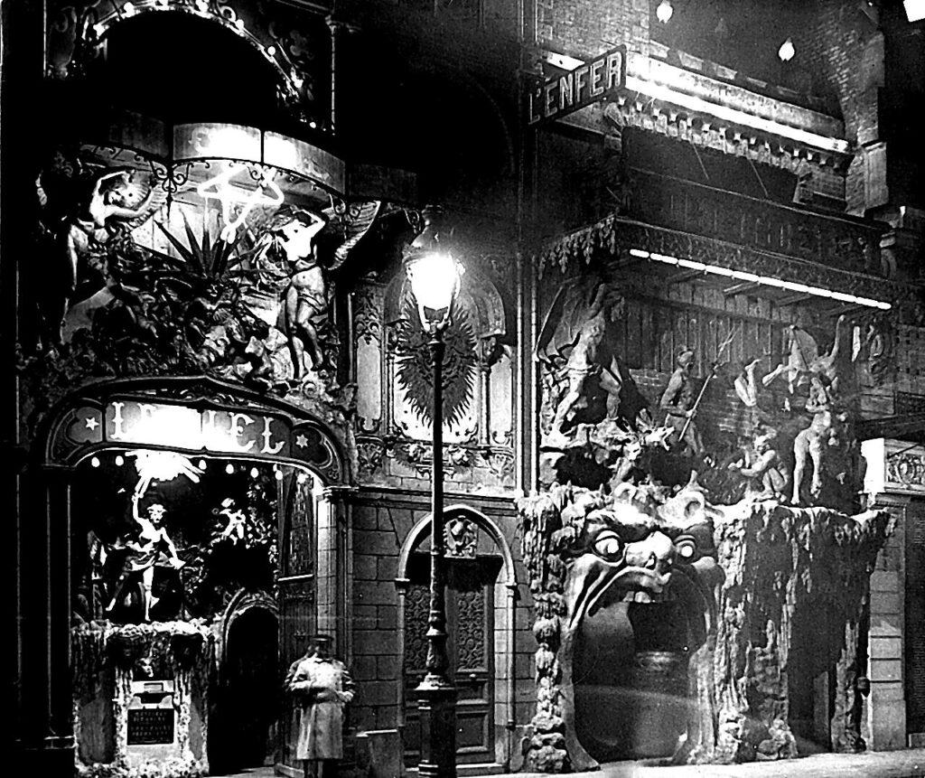 Black and white photograph of the themed facades of Cabaret du Ciel (Heaven) and Cabaret de l'Enfer (Hell) on Boulevard de Clichy in Montmartre, Paris.