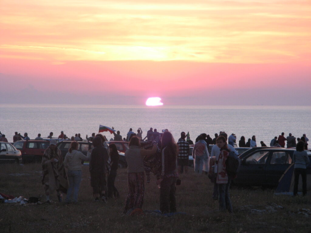 A group of young people gathered at the Black Sea watching the sunrise on July 1, 2007.