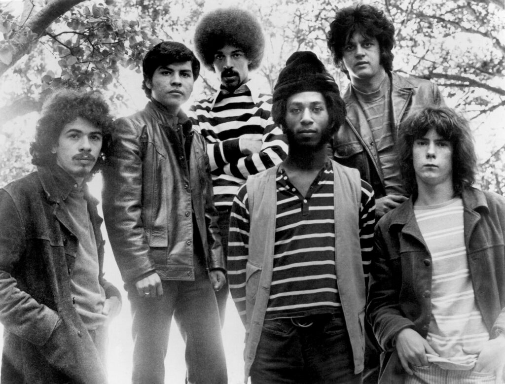 Historic black and white publicity photograph of the rock band Santana posing together in the late 1960s